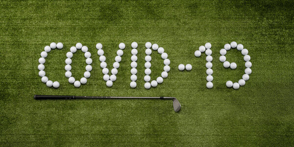 Golf balls with golf clubs that make up the word covid-19 on the lawn of a driving range. Concept of stopping the golf competitions.