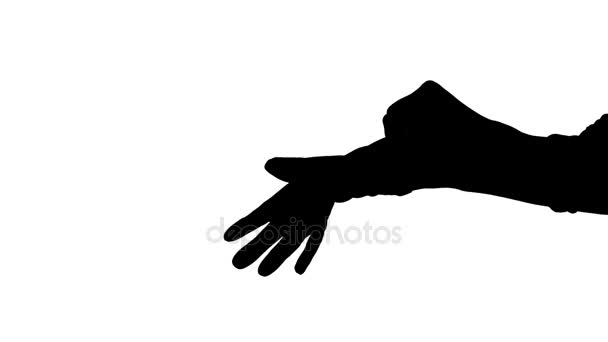 Rörliga kvinnliga händer att sätta på handskar — Stockvideo