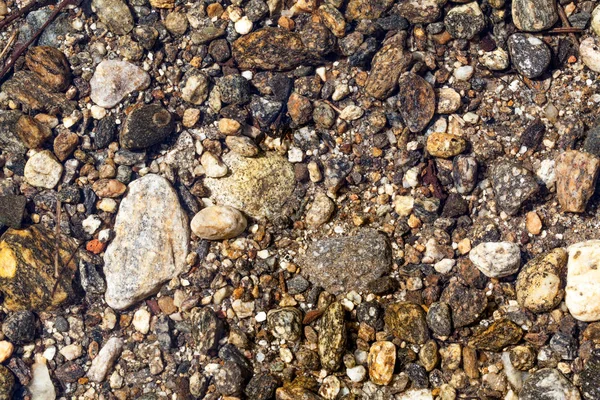 River Bed - Stones beneath the clear water of a river