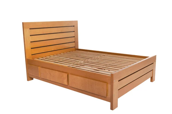 Деревянная двуспальная кровать — стоковое фото