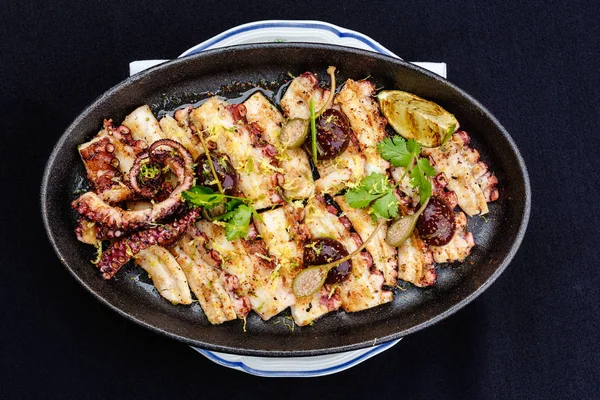 Fried octopus on a brazier — Stock Photo, Image