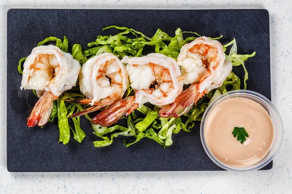 cooked shrimps on black slate