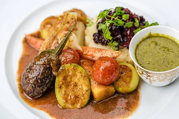 Steamed vegetables with mashed potatoes and sauce