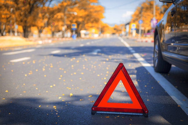 Red triangle, red emergency stop sign, red emergency symbol with  car stop and park on road.
