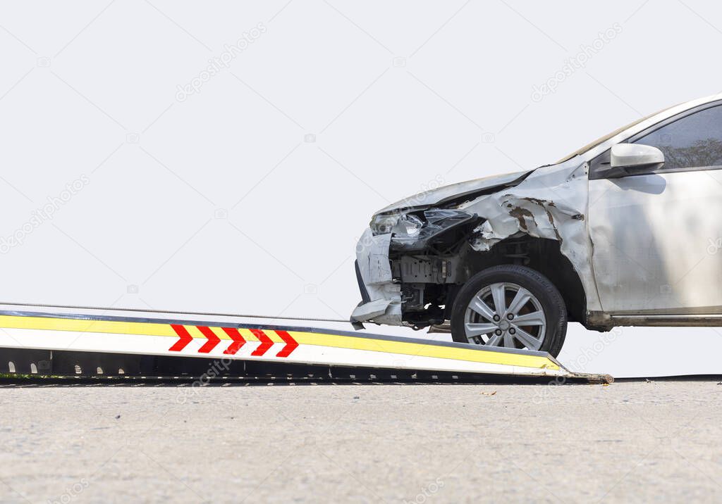 accident Car Slide on  truck for move. Gray car have damage by accident on road take with slide truck move . Isolate on white background.