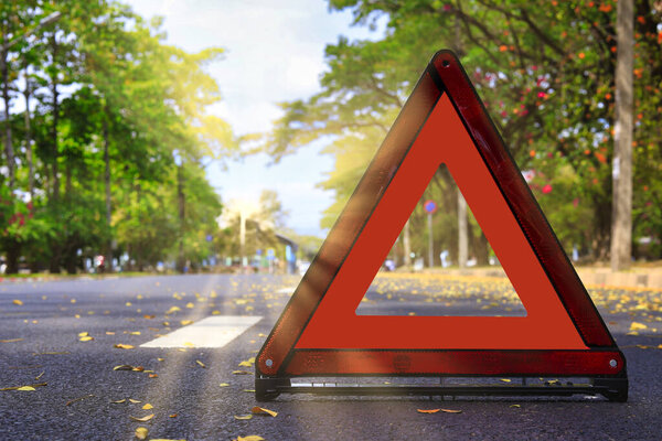 Red triangle, red emergency stop sign, red emergency symbol on road. With copy space for text or design