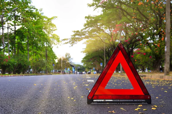 Red triangle, red emergency stop sign, red emergency symbol on road. With copy space for text or design — Stock Photo, Image
