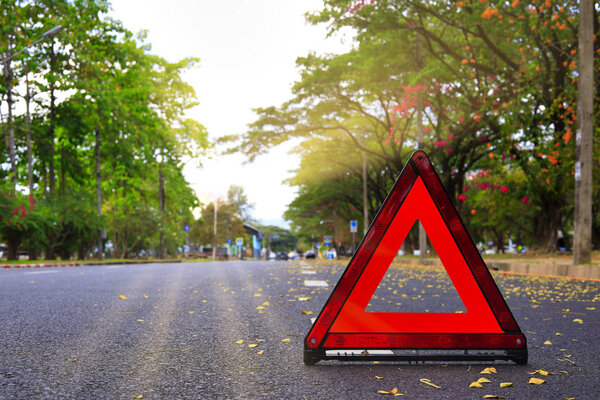 Red triangle, red emergency stop sign, red emergency symbol on road. With copy space for text or design