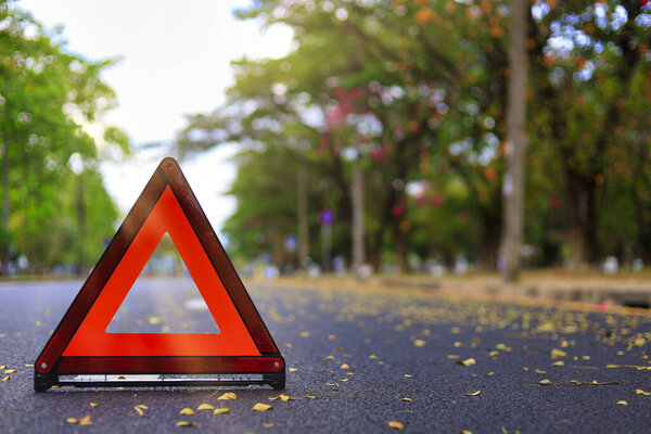Red triangle, red emergency stop sign, red emergency symbol on road. With copy space for text or design