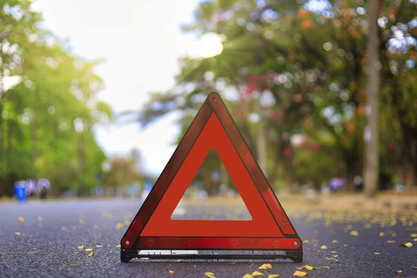 Red triangle, red emergency stop sign, red emergency symbol on road. With copy space for text or design