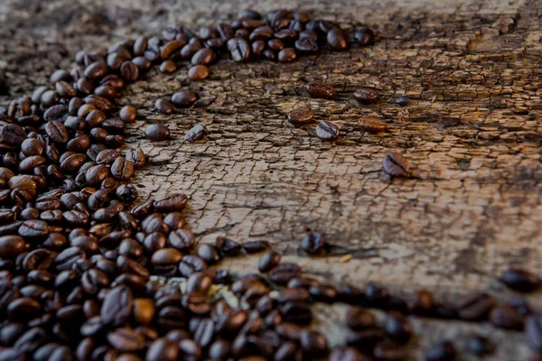 Coffee beans on wood texture background — Stock Photo, Image