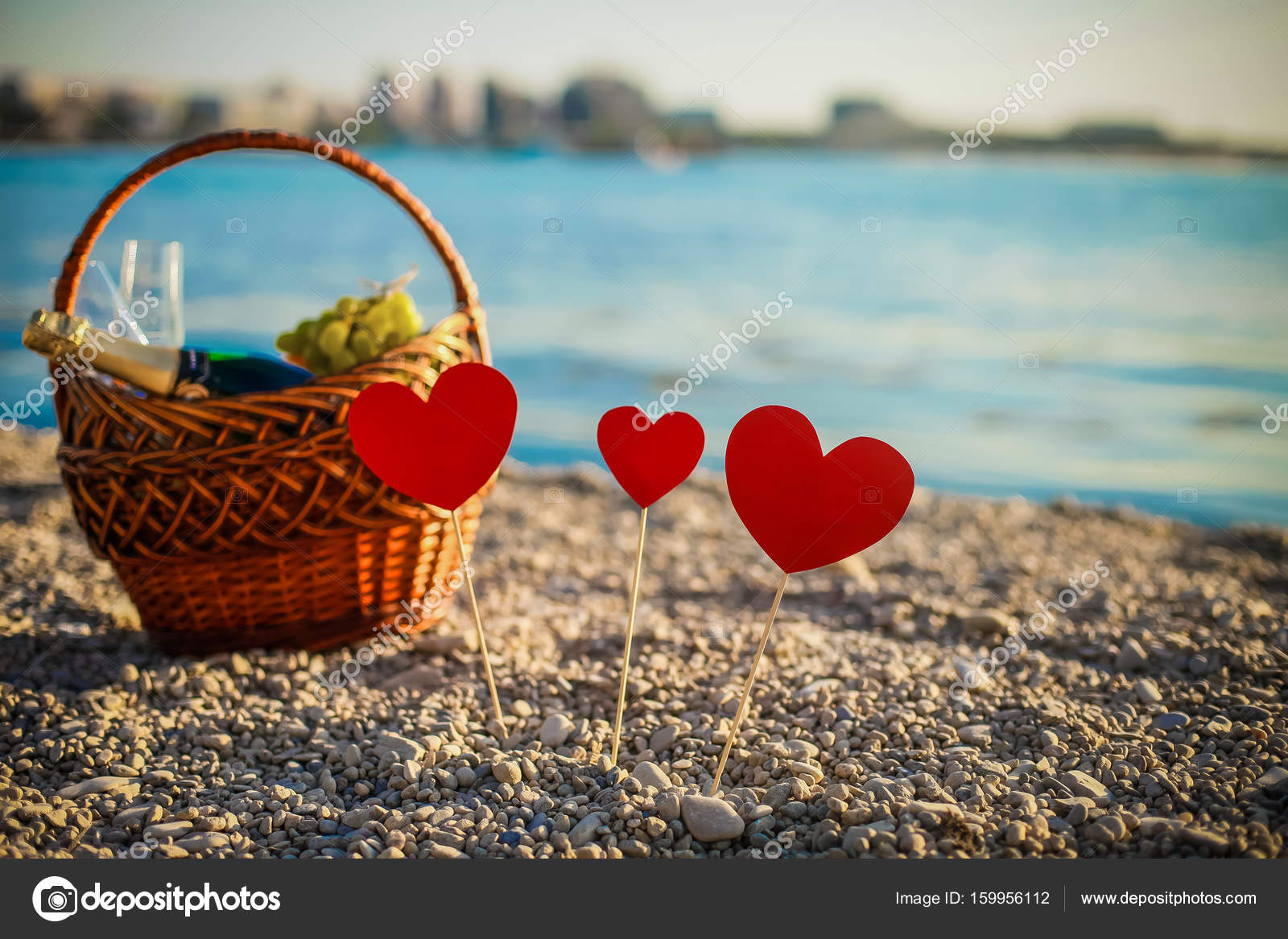 Picnic. champagne. picnic basket. Beautiful sea beach. Hearts on the