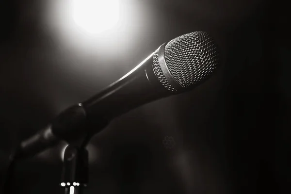 Black and white image of the microphone. The microphone on the stage is close-up. A pub. Bar. A restaurant. Classical music. Music
