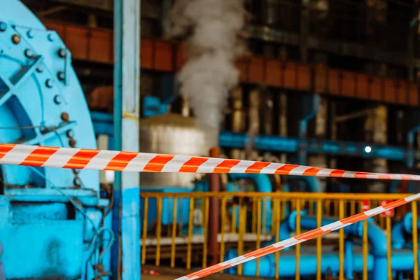 Signal red tape for fast fencing in the enterprise. Power station. — Stock Photo, Image