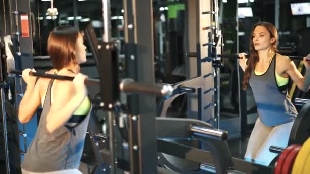 Young Beautiful Woman Gym Doing Sit Ups Bar Front Mirror — Stock Video