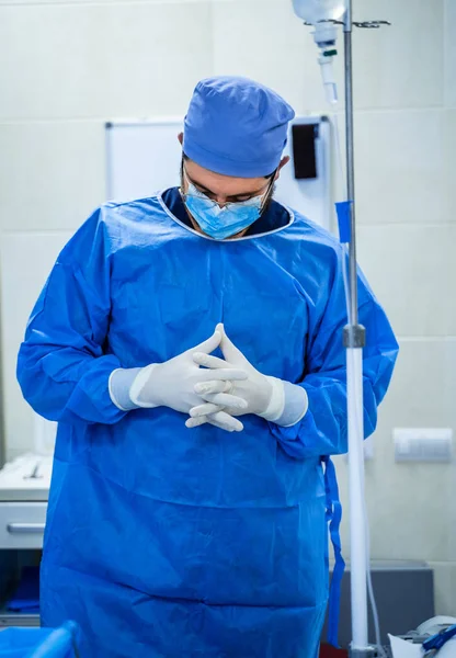 Doctor performing surgery. Modern equipment in operating room.
