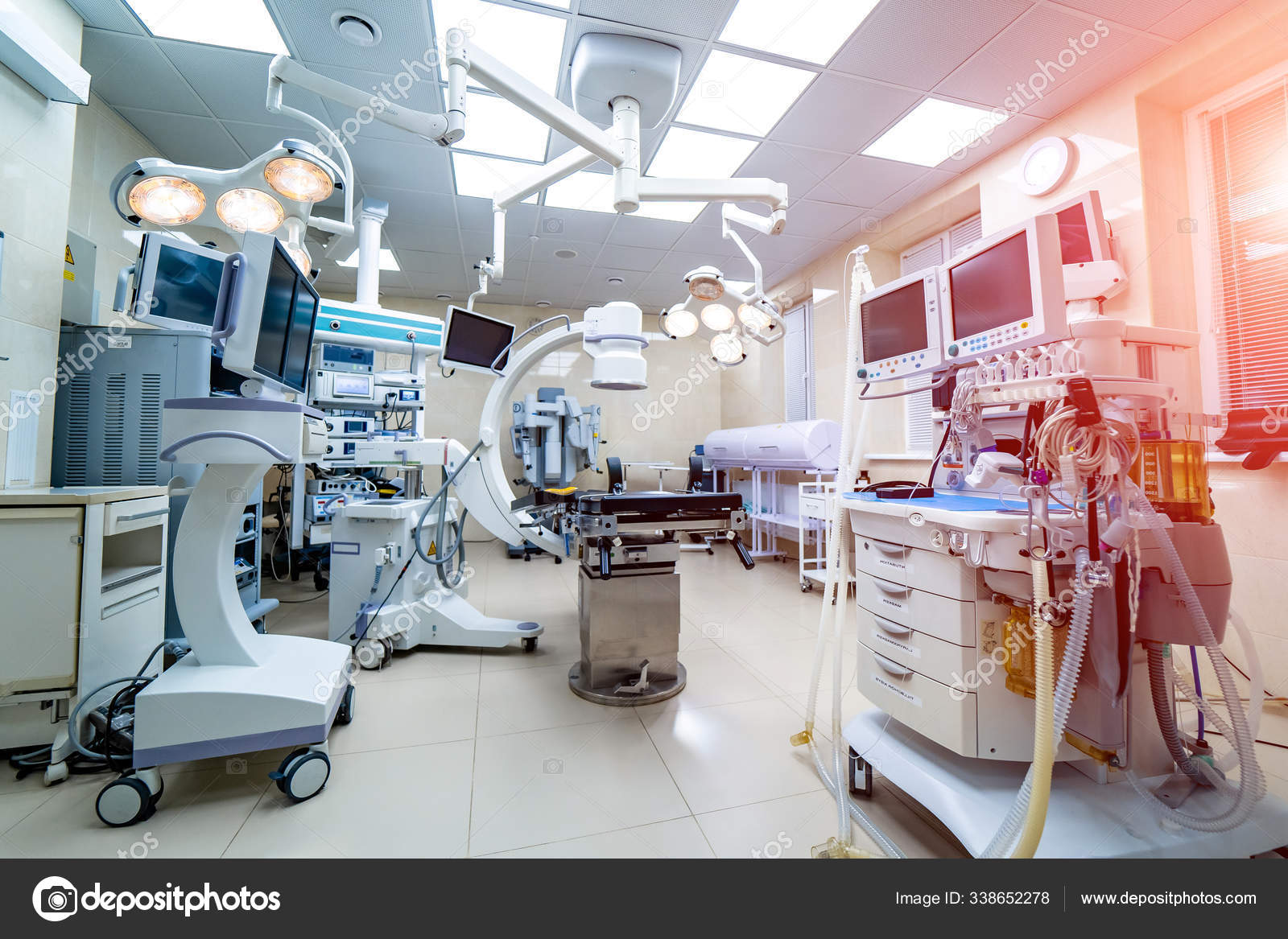 Medical devices and industrial lamps in surgery room of modern hospital