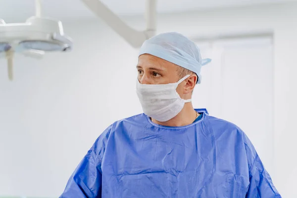 male doctor in operation room with his team