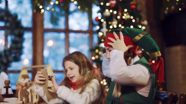 Little Girl Sitting Table Elf Tearing Letter Wishes Santa Claus — Stock Video