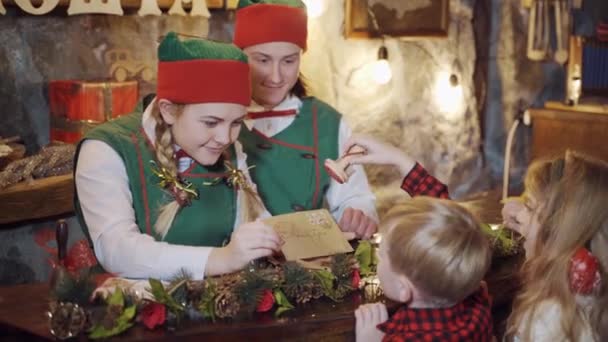 Happy Elves Preparing Letters Children Elves Children Making Envelopes Christmas — Stock Video