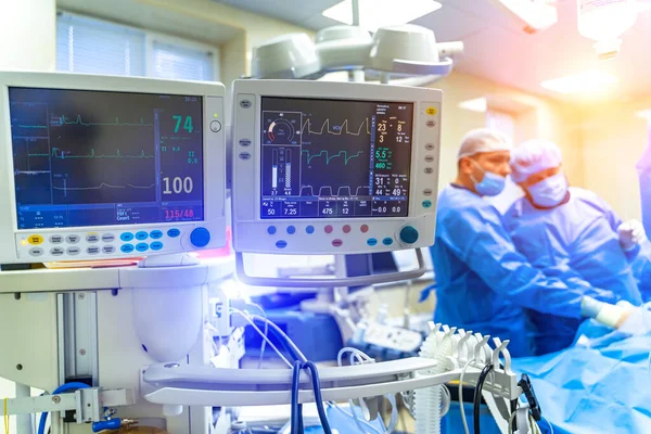 Artificial lung ventilation monitor in the intensive care unit. Nurse with medical equipment. Ventilation of the lungs with oxygen. COVID-19 and coronavirus identification. Pandemic.