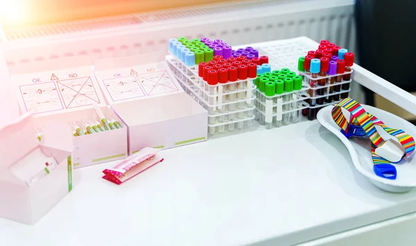 Tubes for analysis in the laboratory of hematology. Special equipment for laboratory. Pneumonia diagnosing. COVID-19 and coronavirus identification. Pandemic. Assistance in scrabs with medicine dropper.