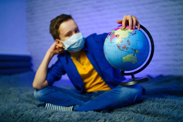 Boy Holds Globe Medical Mask Planet Pandemic Covid Stop Coronavirus — Stock Photo, Image