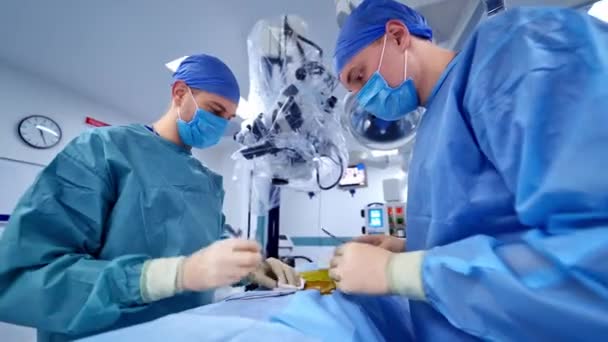 Team Performing Surgical Operation Doctor Wearing Protective Clothing Performing Surgery — Stock Video