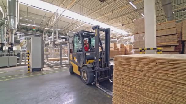 Operator White Helmet Works Electric Loader Carries Pile Wooden Parquet — Stock Video