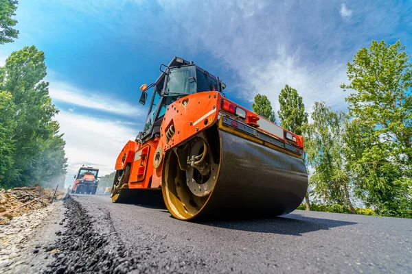 Heavy vibration roller at asphalt pavement works. Road repairing.