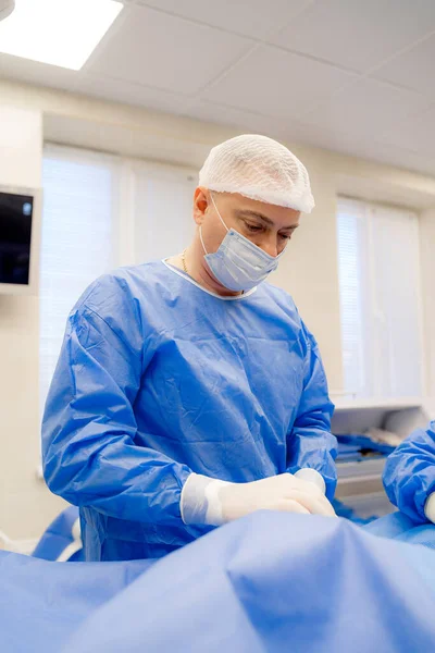 Process of surgery operation using medical equipment. Surgeon in operating room with surgery equipment.