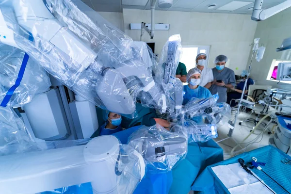 Surgical room in hospital with robotic technology equipment, machine arm surgeon in futuristic operating room. Minimal invasive surgical medical robot.