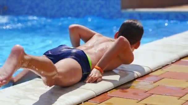 Teenage Boy Jumps Water Child Having Fun Swimming Pool Outdoor — Stock Video