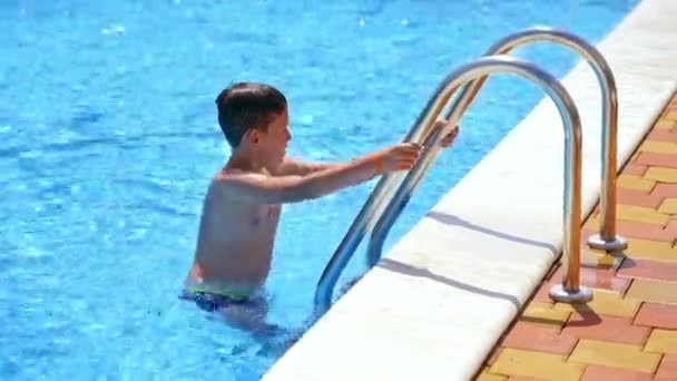 Boy Swimming Pool Outdoors Child Going Out Pool Sunny Summer — Stock Video