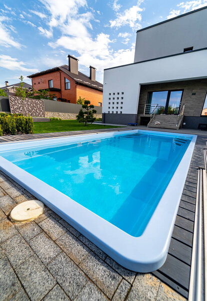 View from the floor. Up-to-date house with open porch and pool. Modern architecture.