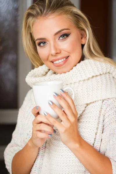 Young blond with hot beverage. — Stock Photo, Image