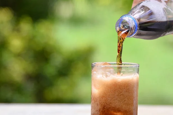stock image Pour cola into glass
