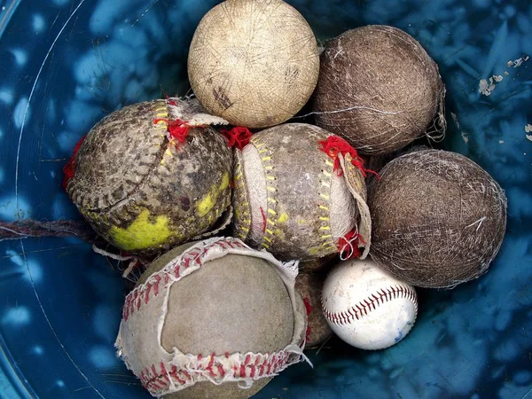 Bucket of old and new baseball — Stock Photo, Image