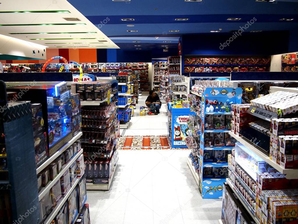 Assorted toys on display at a toy store in a shopping mall. Stock