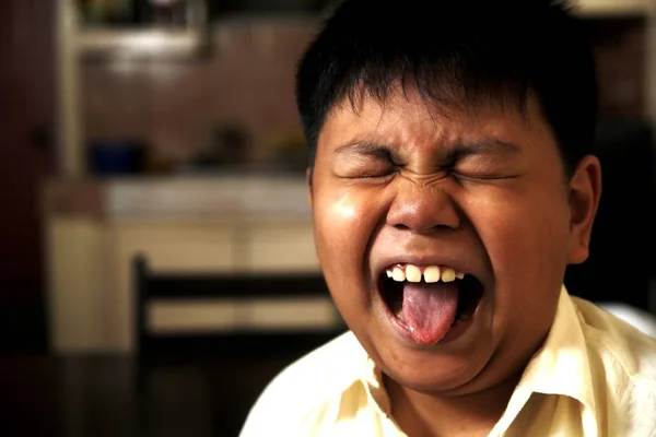 Young Asian boy with funny facial expression — Stock Photo, Image