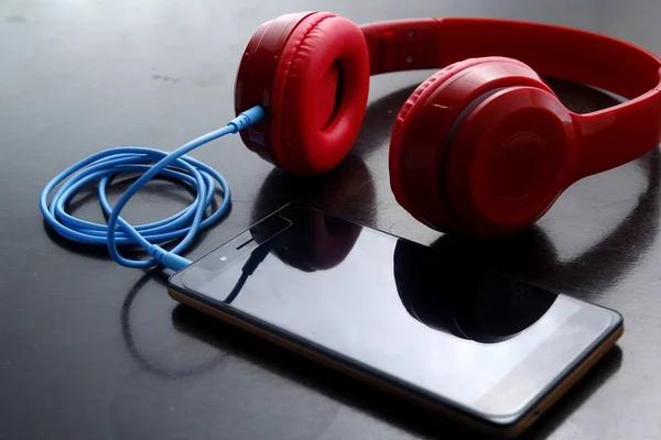 Smartphone and stereo headphones — Stock Photo, Image