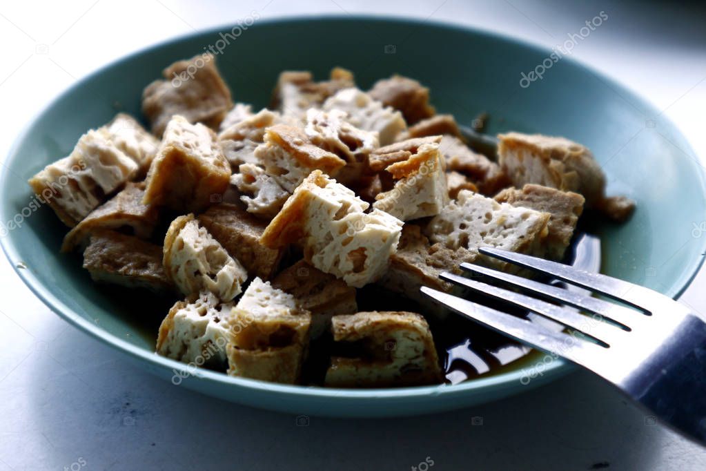 Freshly cooked sliced fried tofu