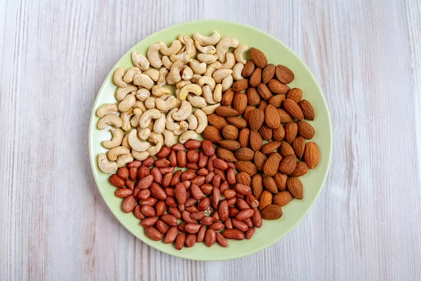 A plate with a mixture of different nuts.