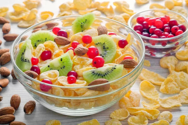 Two Bowls Cornflakes Kiwi Fruits Cranberries Scattered Almonds Cornflakes Table — Stock Photo, Image