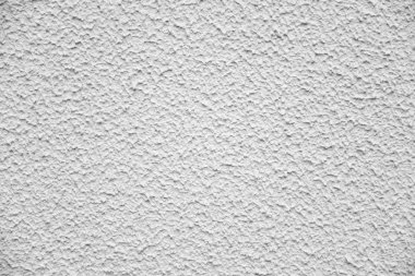 Gri, yıpranmış duvarda yara bandı var..