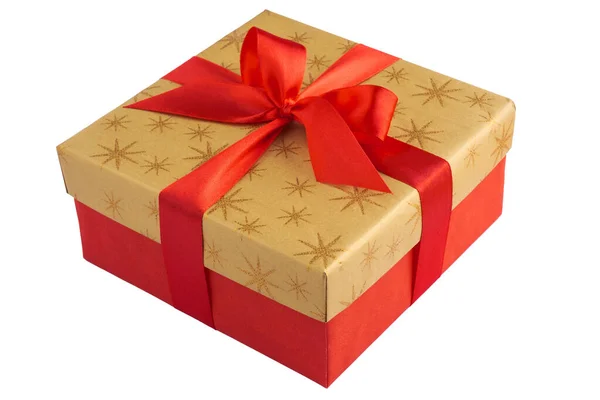 Red gift or present box with golden colored top and red ribbon bow isolated on white background Royalty Free Stock Images