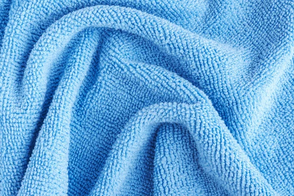 Wrinkled blue microfiber cloth texture of microfiber towel — Stock Photo, Image