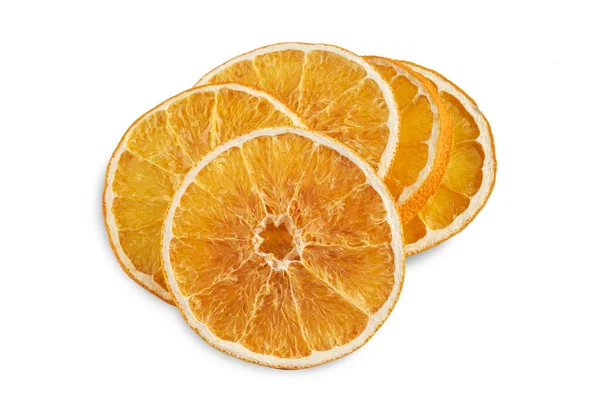 Pilha de fatias de laranja secas isoladas em branco — Fotografia de Stock