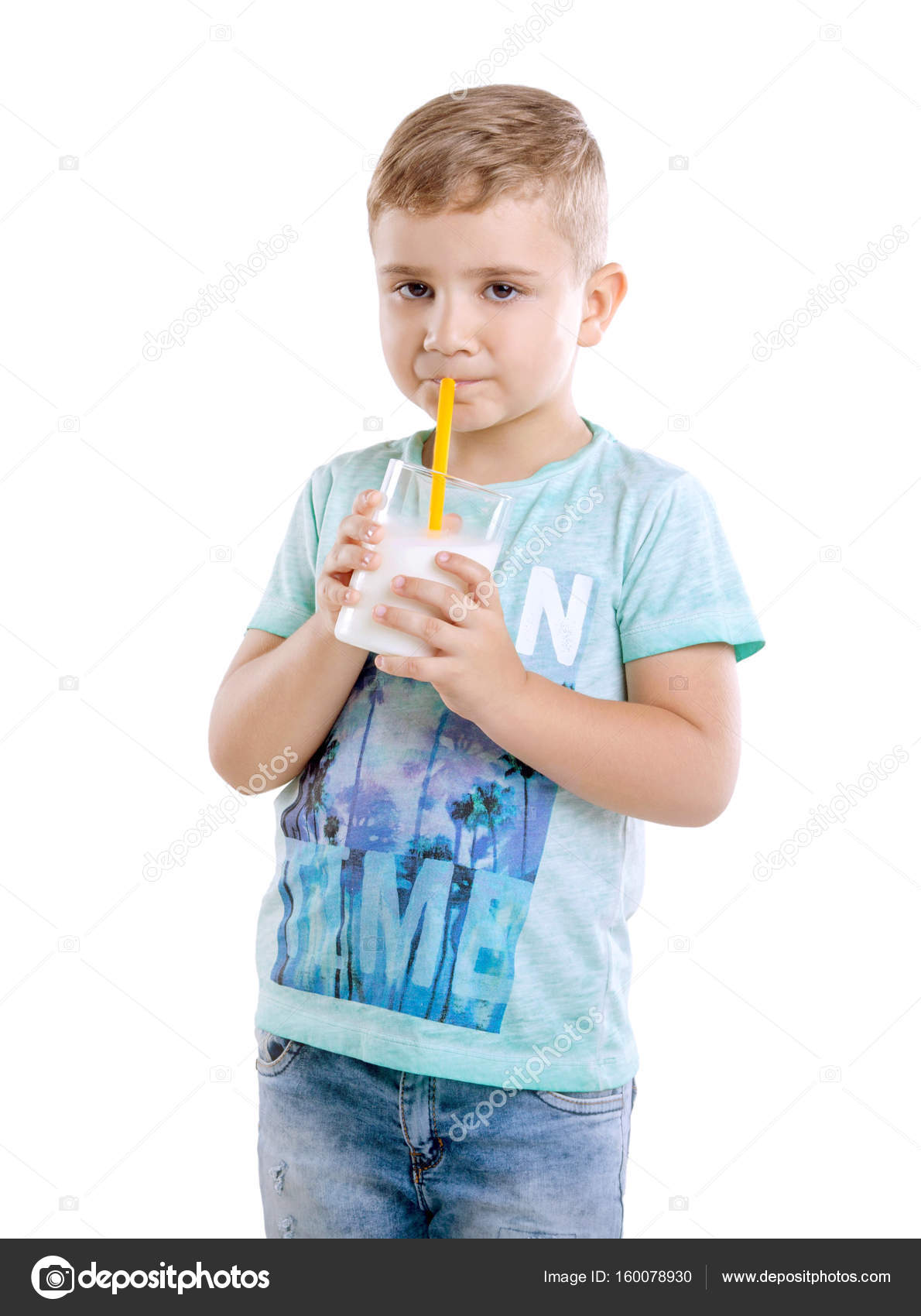 A Wonderful Little Boy Is Standing And Drinking Organic Milk From