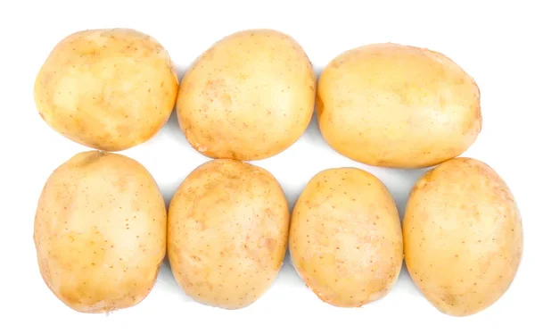 Ovanifrån av en massa fräsch och ekologisk potatis, isolerad på en vit bakgrund. Färskpotatis, närbild. Färska grönsaker. — Stockfoto